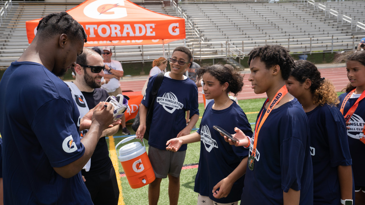 Penn State running back Nicholas Singleton signs autographs at the Nick Singleton Football Camp at Governor Mifflin High School.